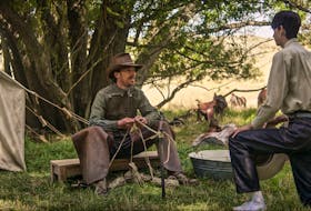 Benedict Cumberbatch as Phil Burbank and Kodi Smit-McPhee as Peter in Netflix’s excellent western-drama, The Power Of The Dog. - Netflix