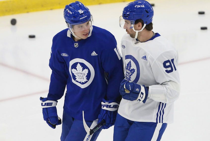 Mitch Marner (left) chatting with John Tavares at a Leafs practice, will be in the lineup against the Blues tonight in St. Louis, along with Pierre Engvall.  