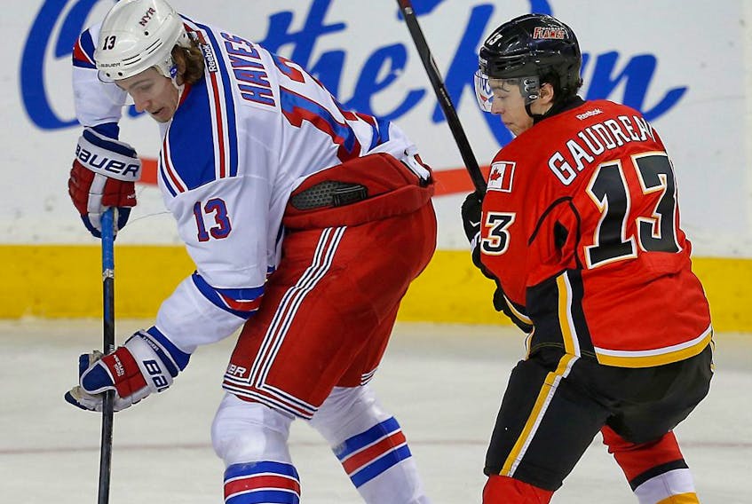  Friends Kevin Hayes, of the New York Rangers, and Johnny Gaudreau, of the Calgary Flames, are pictured during a game at the Saddledome in Calgary on Dec. 16, 2014.