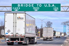 Transport trucks approach the Canada/USA border crossing in Windsor in this file photo from March 2020. 