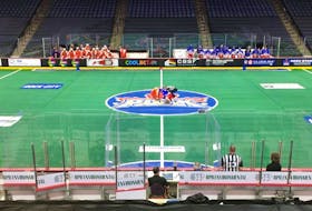 The Halifax Thunderbirds and Toronto Rock get ready for the opening face-off of their National Lacrosse League game in an empty FirstOntario Centre on Saturday night. - POSTMEDIA NEWS