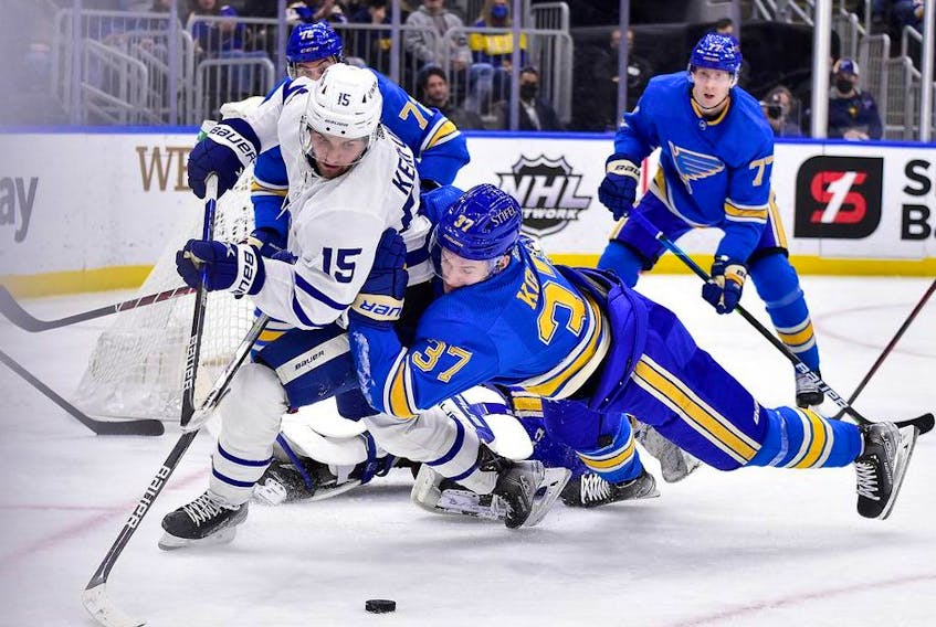 St. Louis Blues center Klim Kostin (37) dives as he defends against Toronto Maple Leafs center Alexander Kerfoot (15) during the third period at Enterprise Center. 
