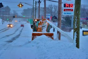 A sidewalk plow operator was busy moving snow in Coldbrook near the McDonald’s restaurant. 
Adrian Johnstone