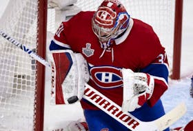 Montreal Canadiens' Carey Price makes a blocker save against Tampa Bay Lightning during Game 3 of the Stanley Cup final, in Montreal on July 2, 2021. 