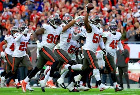 Shaquil Barrett #58 of the Tampa Bay Buccaneers celebrates after intercepting a pass against the Philadelphia Eagles during the third quarter in the NFC wild card game at Raymond James Stadium on January 16, 2022 in Tampa, Florida. 