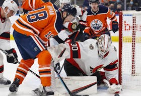 Oilers forward Zach Hyman (left) looks for a rebound in front of Senators goaltender Matt Murray on Saturday.  Murray stopped 60-of-65 shots in two wins against the Flames and Oilers.