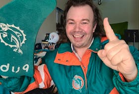 Mavs Gillis, originally of Sydney River, shows his support of the Miami Dolphins. While the Dolphins are not part of this year’s NFL playoffs, Gillis lost a bet with longtime friend Patrick McNeil which involved the Dolphins and Cincinnati Bengals. PHOTO CONTRIBUTED/MAVS GILLIS