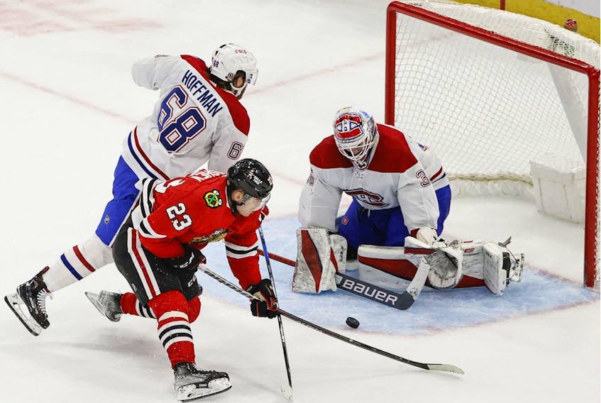 Chicago Blackhawks centre Philipp Kurashev (23) scores the game-winning goal against the Montreal Canadiens in overtime at United Center Jan. 13, 2022.