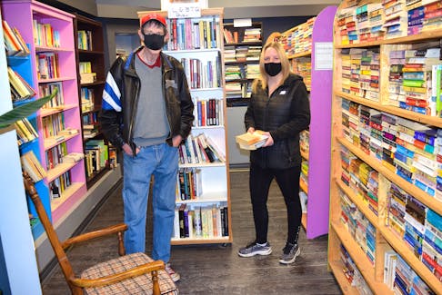 Nicole Wallace of Sydney, right, made a post on social media on Friday that created a flurry of public support for Ed’s Books and More on Charlotte Street in Sydney and owner Ed Gillis, left. Gillis said he is grateful. Sharon Montgomery-Dupe/Cape Breton Post