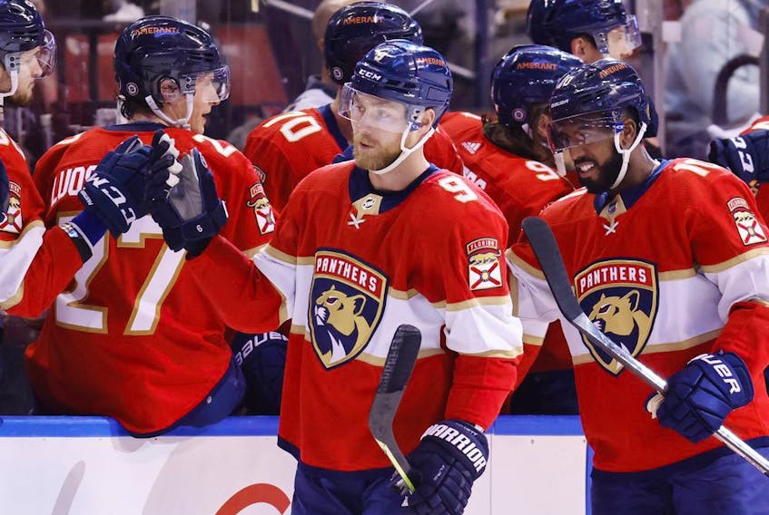 Sam Bennett (centre) and Anthony Duclair (right) of the Florida Panthers celebrate Bennett’s goal against the Dallas Stars with teammates at FLA Live Arena in Sunrise, Fla., on Friday, Jan. 14, 2022.