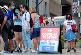 People line up at a coronavirus mobile testing van in New York City on Aug. 27, 2021. With just 4.25 per cent of the world's population, the U.S. has recorded 20 per cent of the world's COVID-19 cases and 15.6 per cent of the total death tolls.