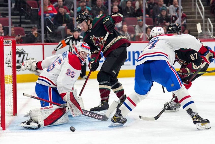 Arizona Coyotes right wing Christian Fischer (36) shoots against Montreal Canadiens goaltender Sam Montembeault (35) during the third period at Gila River Arena Monday, Jan. 17 in Glendale, Ariz.