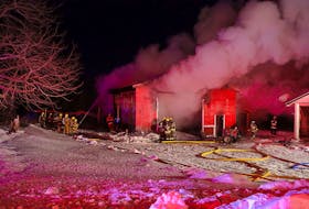 Kentville, New Minas, Waterville and Port Williams battle a garage fire on Church Street in Chipmans Corner on Jan. 16. – Adrian Johnstone