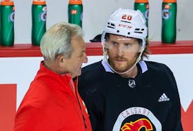 Calgary Flames head coach Darryl Sutter talks with Blake Coleman during a recent practice.
