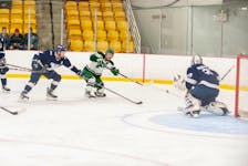 UPEI Panthers left-winger Kyle Maksimovich, 9, directs a shot at St. Francis Xavier X-Men goaltender Blade Mann-Dixon. The action took place during an Atlantic University Sport men's hockey game at MacLauchlan Arena in Charlottetown earlier this season. 