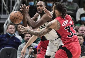Raptors guard Gary Trent Jr. (33) tries to steal the ball from Bucks forward Khris Middleton. Trent Jr.’s defence has been a pleasant surprise this season. 