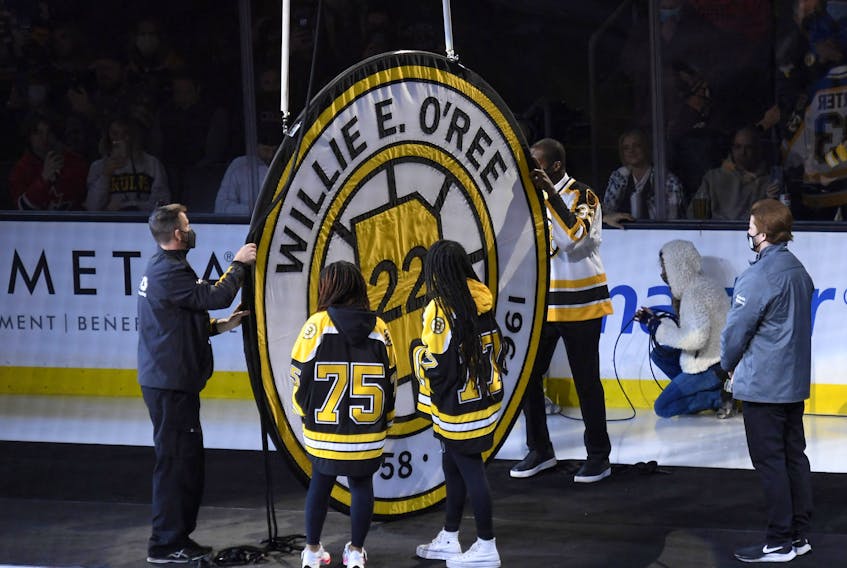  Former Boston Bruins player Willie O’Ree has his number retired and raised to the rafters prior to a game against the Carolina Hurricanes at TD Garden on Tuesday, Jan. 18, 2022.
