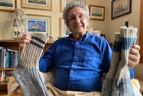 Calixte Thibodeau of Meteghan River holds a pair of wool socks he gifted sailor Kirsten Neuschäfer with. The woman, an experienced skipper from South Africa, purchased a sailboat in Newfoundland and had it refitted in Prince Edward Island for the Golden Globe Race 2022. The race around the globe begins in mid-June.
CARLA ALLEN • TRI-COUNTY VANGUARD
