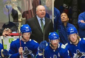 New Canucks head coach Bruce Boudreau in his debut behind the team bench on Dec. 6, 2021 against the Los Angeles Kings at Rogers Arena.