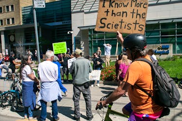  People gather outside Toronto General Hospital, on September 13, 2021, to protest against COVID-19 vaccines, vaccine passports and COVID-19 related restrictions.