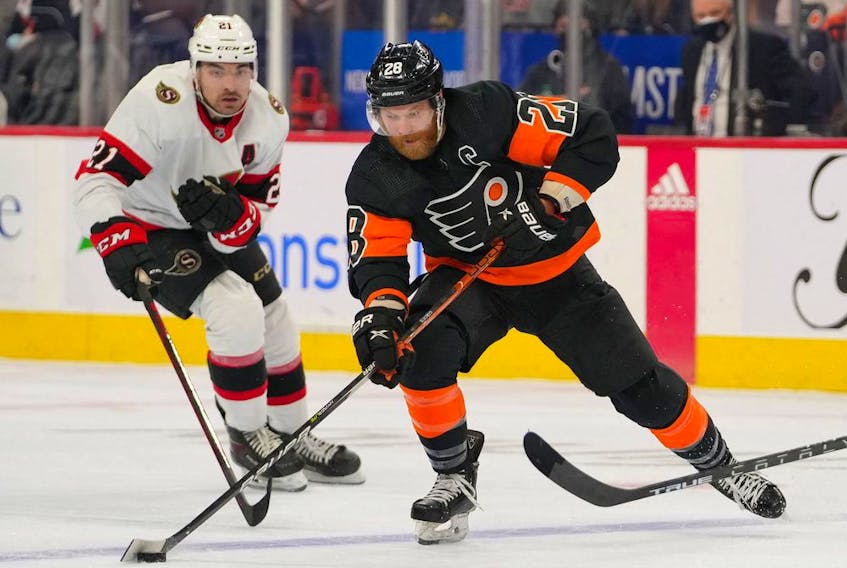 Senators forward Nick Paul, left, seen here in the team's previous game against the Philadelphia Flyers on Dec. 18, was among the Ottawa players placed on the NHL's COVID-19 protocol list on Saturday.