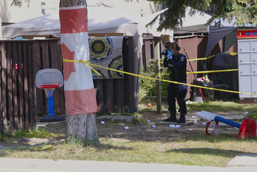 A man, 29, was shot dead at a townhouse complex on Smith Lane in Ajax on Wednesday, June 2, 2021. The gunfire erupted at the rear of a row of townhouse where area residents say a large party was underway. (Chris Doucette/Toronto Sun/Postmedia Network)