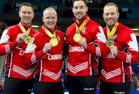 The Brad Gushue team flashes its gold medals following the Canadian Olympic trials in November in Saskatoon, Sask. From left, are Gushue, third Mark Nichols, second Brett Gallant and lead Geoff Walker.