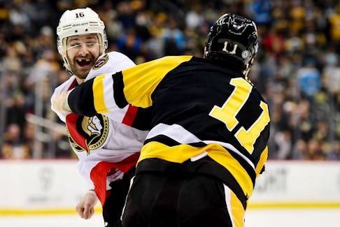 Austin Watson of the Ottawa Senators and Brian Boyle of the Pittsburgh Penguins fight during Thursday's game.