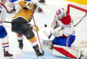 Montreal Canadiens goaltender Sam Montembeault (35) makes a save against Vegas Golden Knights left wing William Carrier (28) during the third period at T-Mobile Arena.