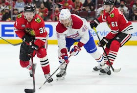 Joel Armia of the Montreal Canadiens pursues Brandon Hagel of the Chicago Blackhawks during the first period at United Center on Jan. 13, 2022, in Chicago.