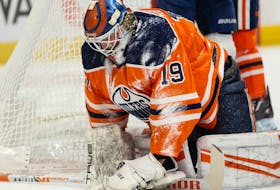 Edmonton Oilers' goaltender Mikko Koskinen (19) is snowed by Florida Panthers' Anthony Duclair (10) during second period NHL action at Rogers Place in Edmonton, on Thursday, Jan. 20, 2022. 