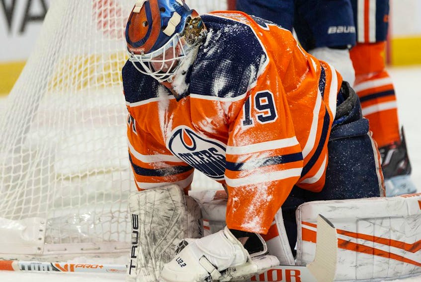 Edmonton Oilers' goaltender Mikko Koskinen (19) is snowed by Florida Panthers' Anthony Duclair (10) during second period NHL action at Rogers Place in Edmonton, on Thursday, Jan. 20, 2022. 