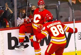Calgary Flames forward Blake Coleman celebrates with Andrew Mangiapane after scoring against the Florida Panthers at Scotiabank Saddledome in Calgary on Tuesday, Jan. 18, 2022. 