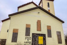 The contractor of a church has put the words 'FOOD AND WATER INSIDE' on the outside of the St. Anthony's Church in Glace Bay, which is slated for demolition and has been the home for hundreds of pigeons and starlings for years. JESSICA SMITH/CAPE BRETON POST