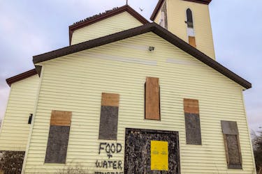 The contractor of a church has put the words 'FOOD AND WATER INSIDE' on the outside of the St. Anthony's Church in Glace Bay, which is slated for demolition and has been the home for hundreds of pigeons and starlings for years. JESSICA SMITH/CAPE BRETON POST