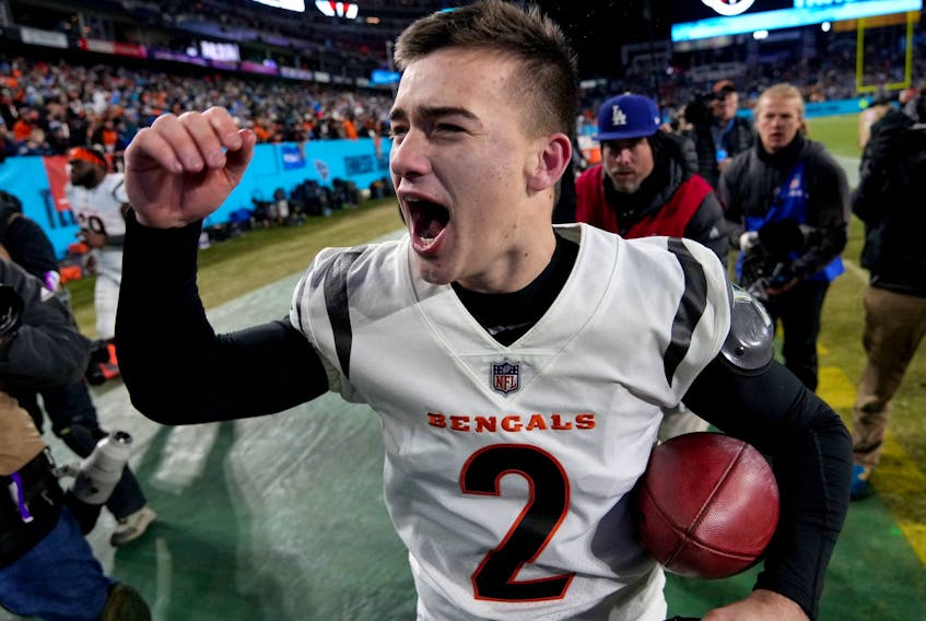 Cincinnati Bengals kicker Evan McPherson celebrates after kicking the game-winning 52-yard field goal to defeat the Tennessee Titans 19-16 during the AFC Divisional playoff football game at Nissan Stadium in Nashville, Tenn., Jan. 22, 2022. 