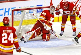 Calgary Flames goalie Jacob Markstrom and teammates react after a goal by the Ottawa Senators at  Scotiabank Saddledome in Calgary on Thursday, Jan. 13, 2022.