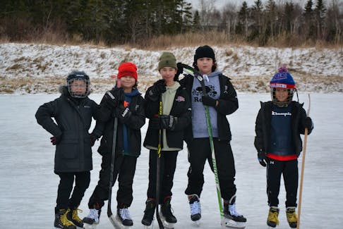 It was all smiles on the outdoor skating rink known as Buster's Pond in Membertou Saturday afternoon. Pictured left to right are Paytra and Jude Christmas, Kingston Laporte, Aaden Isadore, and Joey Sylvester. ARDELLE REYNOLDS/CAPE BRETON POST