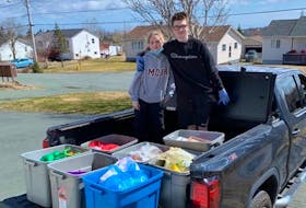 Traci Gardiner and her children, 13-year-old Klaire (left) and 15-year-old Cameron (right) have been organizing a food drive since April 2020. Recently, Gardiner has noticed a decrease in donations. While there are many potential reasons, the rise in the cost of food is absolutely one of them, she said.