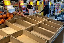 In this file photo, empty shelves at a grocery store in Toronto are pictured on Jan. 22, 2021. 