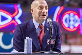 Kent Hughes answers questions at a news conference introducing him as the Montreal Canadiens' new general manager at the Bell Centre in Montreal on Jan. 19, 2022. 