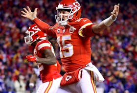 Patrick Mahomes of the Kansas City Chiefs celebrates a touchdown scored by Tyreek Hill against the Buffalo Bills during the fourth quarter in the AFC Divisional Playoff game at Arrowhead Stadium on Jan. 23, 2022 in Kansas City, Miss.