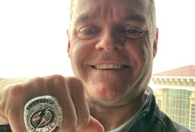 Grant Sonier of Summerside poses with the Tampa Bay Lightning's 2020-21 Stanley Cup ring. Sonier recently received the ring during the team's mid-season scouting meetings in Tampa Bay. Sonier worked as an amateur scout during the 2020-21 campaign. During that same trip, Sonier received a promotion to assistant director of amateur scouting.  