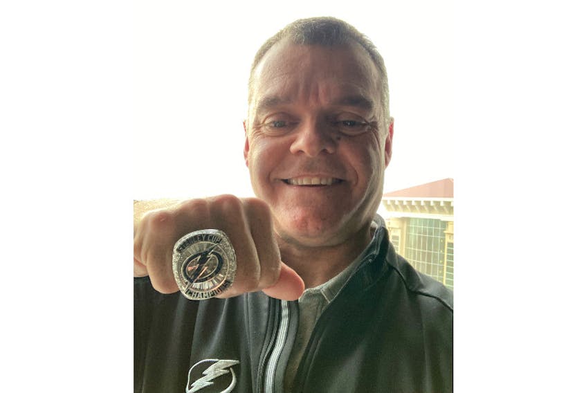 Grant Sonier of Summerside poses with the Tampa Bay Lightning's 2020-21 Stanley Cup ring. Sonier recently received the ring during the team's mid-season scouting meetings in Tampa Bay. Sonier worked as an amateur scout during the 2020-21 campaign. During that same trip, Sonier received a promotion to assistant director of amateur scouting.