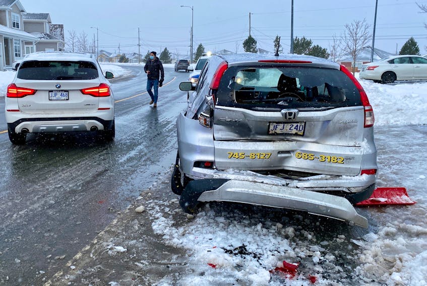 A man shovelling his driveway was sent to hospital with non-life-threatening injuries safter being struck by an suv involved in a two-vehicle collision on Stavanager Drive on Tuesday morning, Jan. 25, 2022.