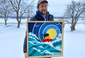 Artist Will Cooper showcases one of his recently-completed works of art.