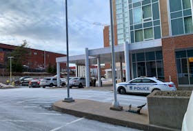 Multiple Halifax Regional Police vehicles are outside of the Hampton Inn and Suites at 1960 Brunswick St. in downtown Halifax after a woman was found dead in a room on Wednesday, Jan. 26, 2022.