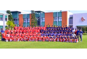 Christian Vogler, second row, far left, works with the Boston Red Sox Latin American players at its academy in the Dominican Republic.