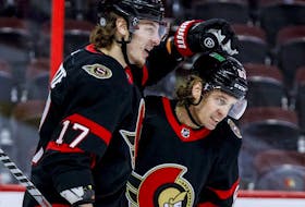 Ottawa Senators centre Adam Gaudette (17) congratulates Ottawa Senators right wing Tyler Ennis (63) after a goal during the first period on Tuesday night.