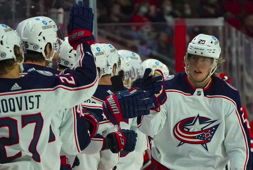 Columbus Blue Jackets winger Patrik Laine is congratulated after his goal against the Carolina Hurricanes at PNC Arena in this photo from Jan. 13.